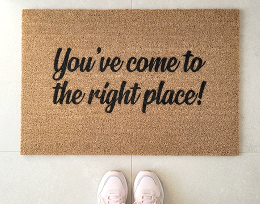 Doormat with 'You've come to the right place!' text on a light background