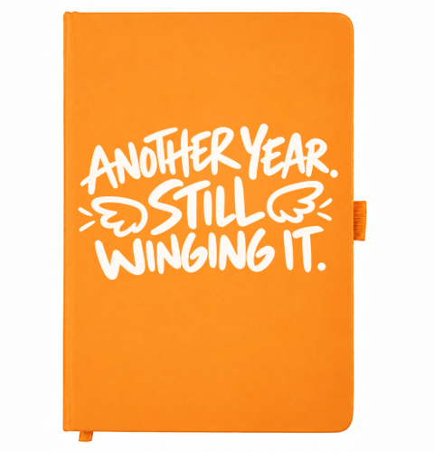 Another Year Still Winging It orange birthday notebook